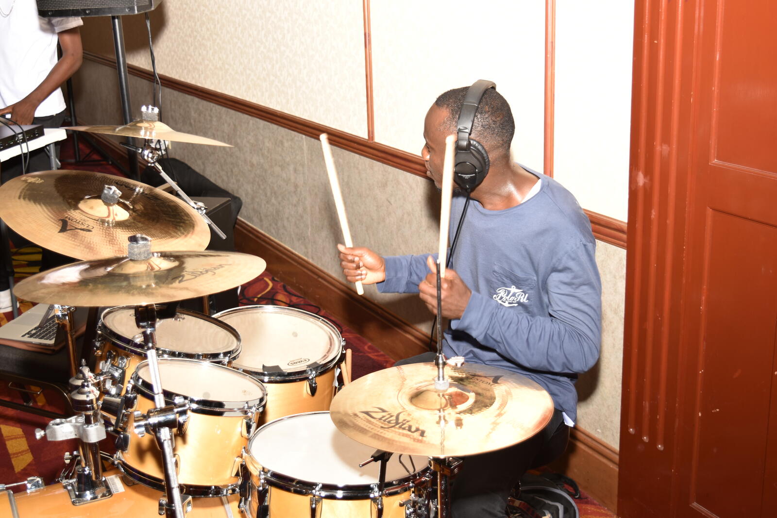 A young drummer playing